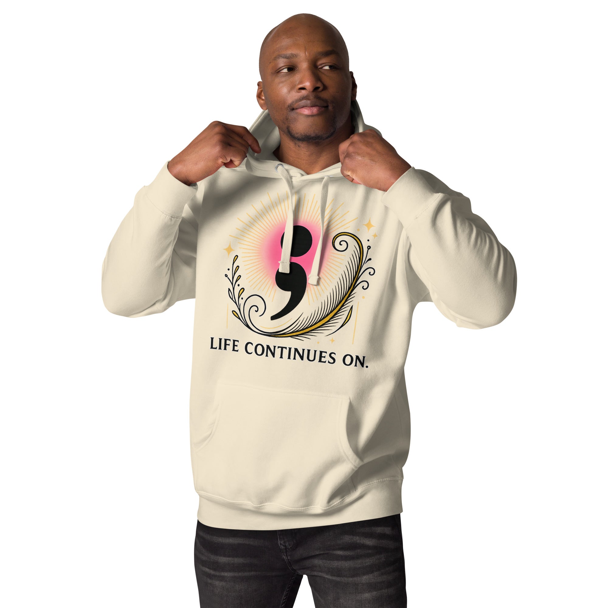 Male model in cream hoodie featuring a pink-gold semicolon design and uplifting “Life Continues On” text.