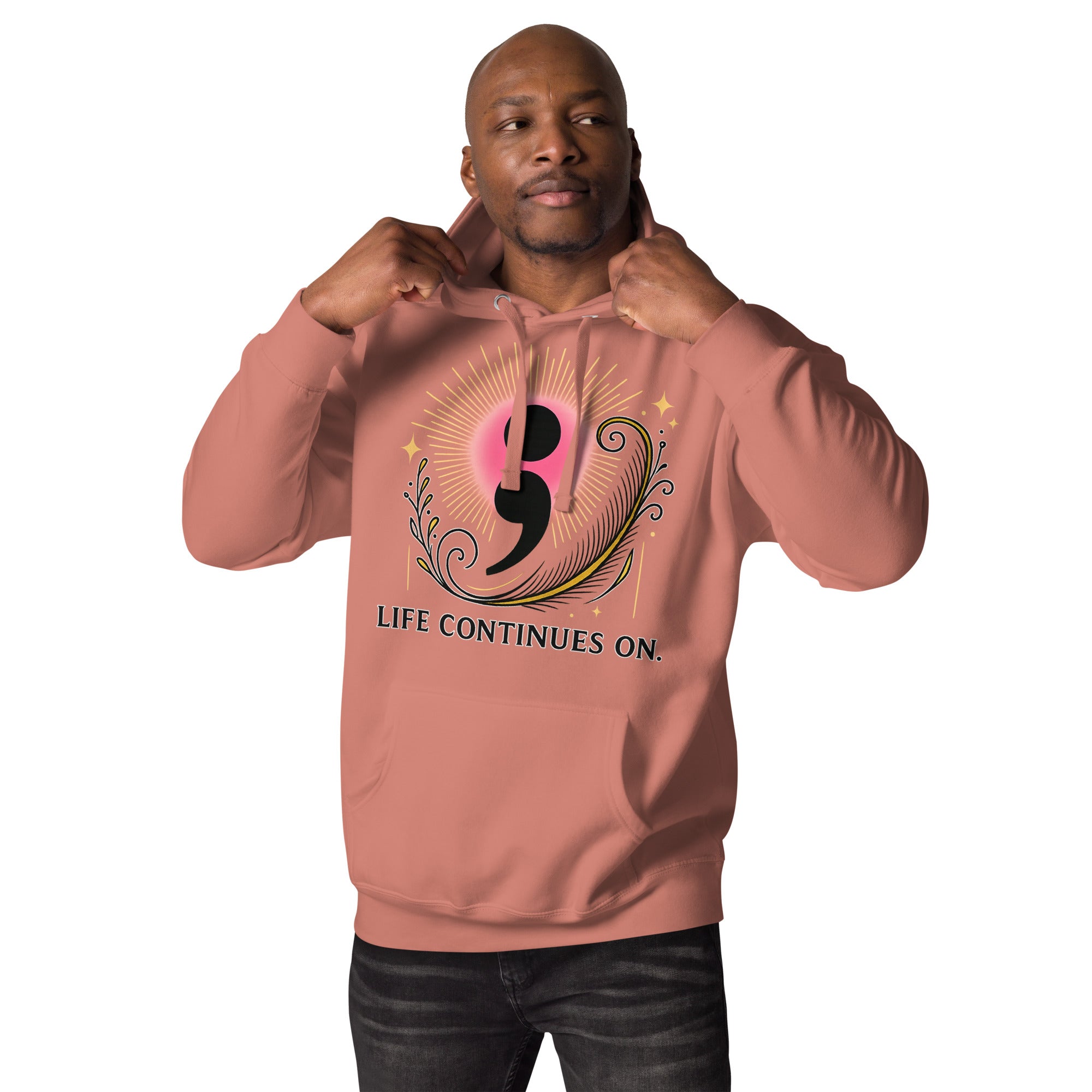Male model wearing rose-colored hoodie with inspirational semicolon artwork and “Life Continues On” message.Product mockup