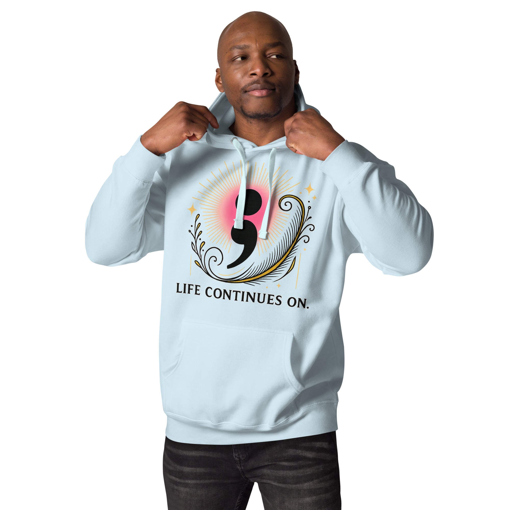 Man wearing light blue hoodie with motivational semicolon symbol and “Life Continues On” typography.